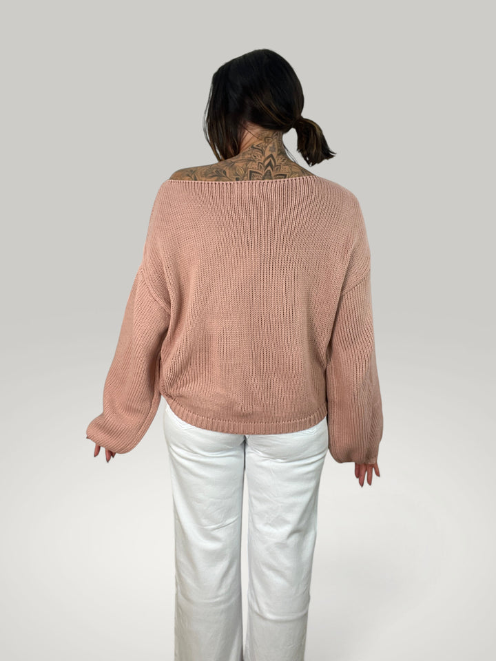 Isabelle Hannover camisola de malha rosa com corte largo, decote redondo e mangas balão, vista de costas.