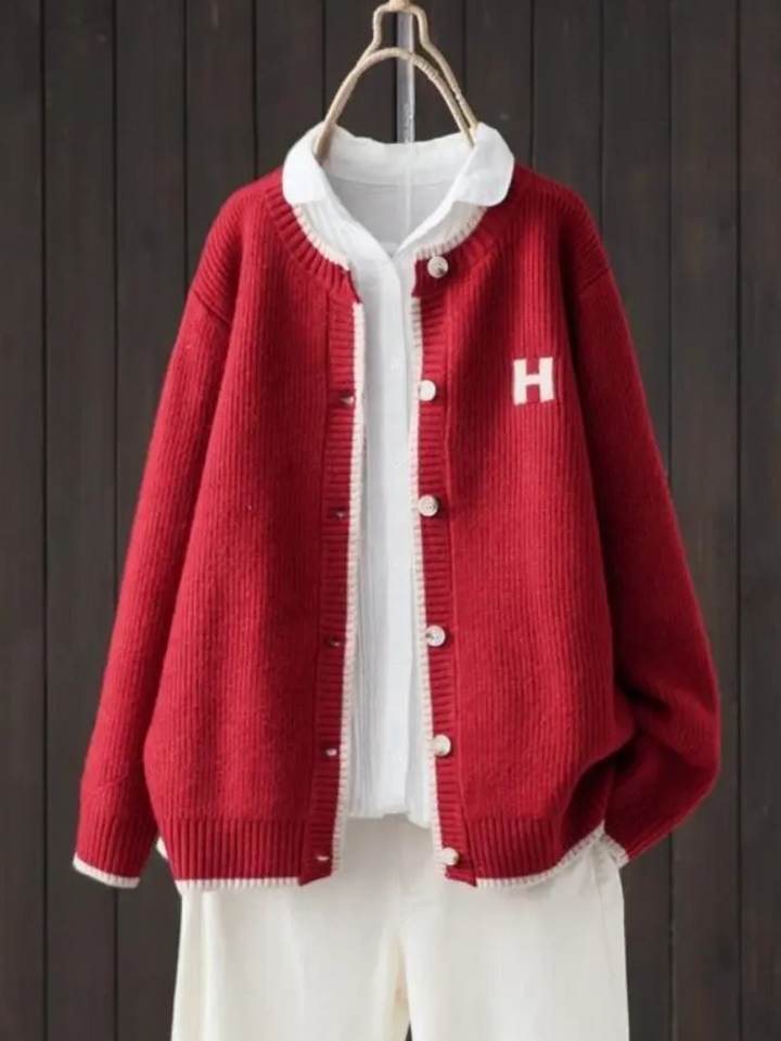 Sundra | Damen Oversized Strickjacke mit H-Logo" can be rewritten as:

"Sundra | Damen Oversized Strickjacke mit H-Emblem